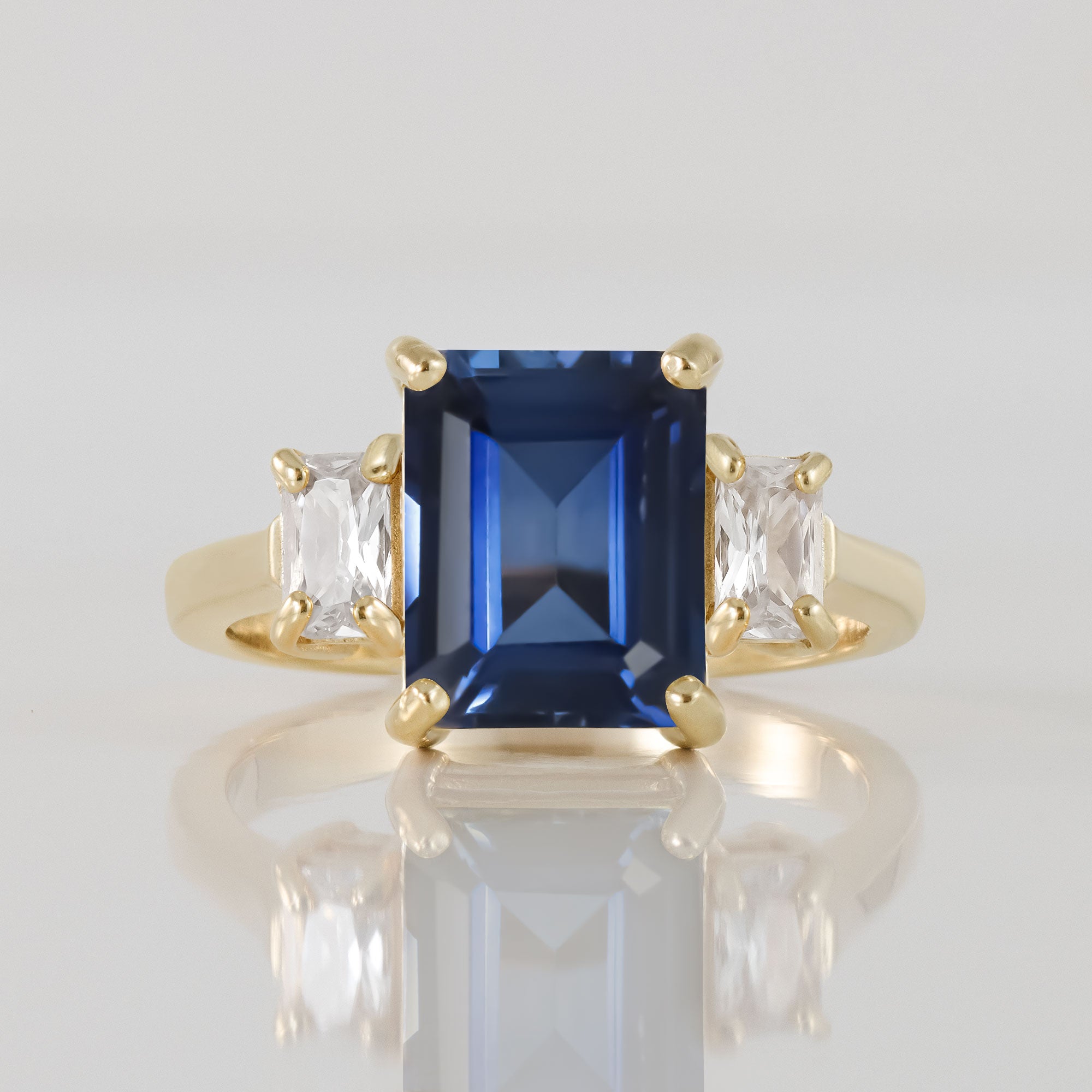 Captivating Brilliance: Statement Engagement Ring with Octagon Blue Sapphire and Clear Quartz Accents