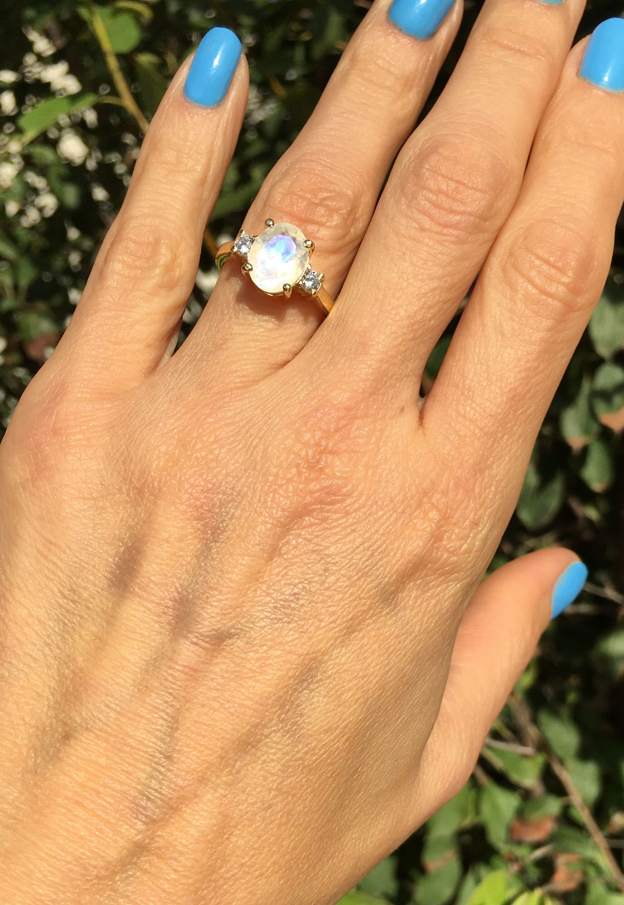 Exquisite, lovely women&#39;s oval cut genuine moonstone ring set with 2 round cut clear quartz.