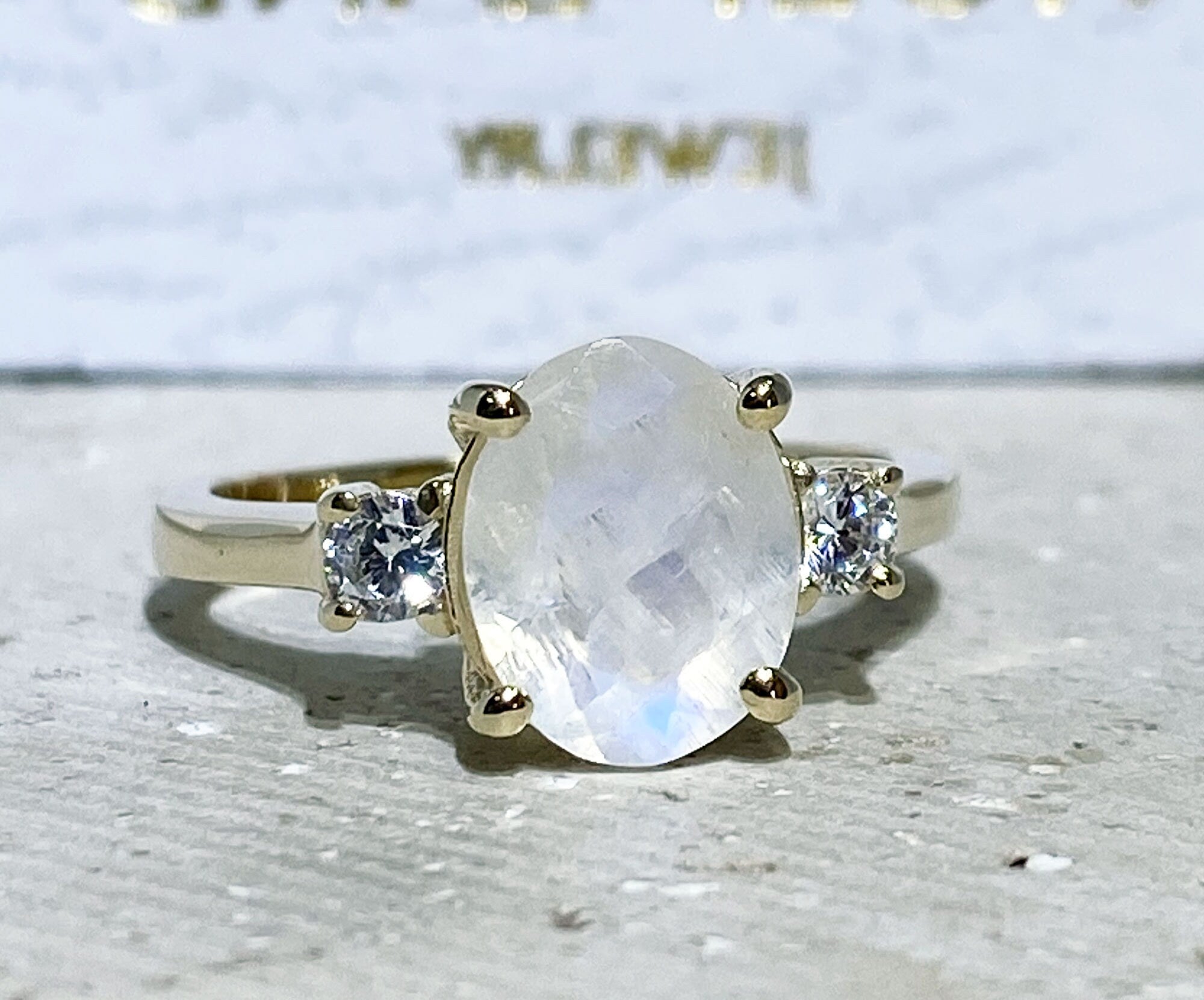 Exquisite, lovely women&#39;s oval cut genuine moonstone ring set with 2 round cut clear quartz.