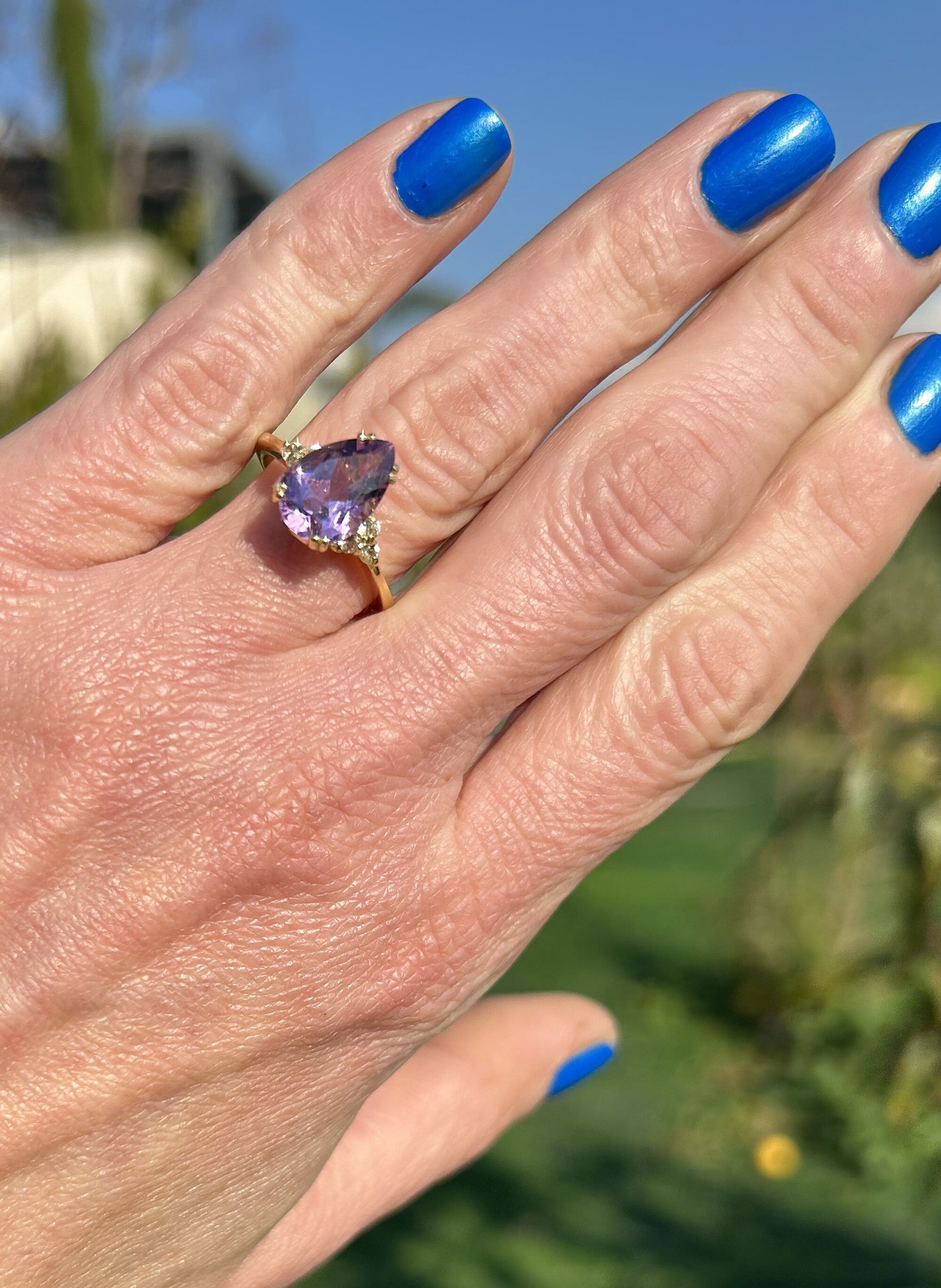 An absolute stunner, classic purple amethyst engagement ring with a pear cut gemstone of your choice as it’s centre stone and with round cut clear quartz on the band to further accentuate it.