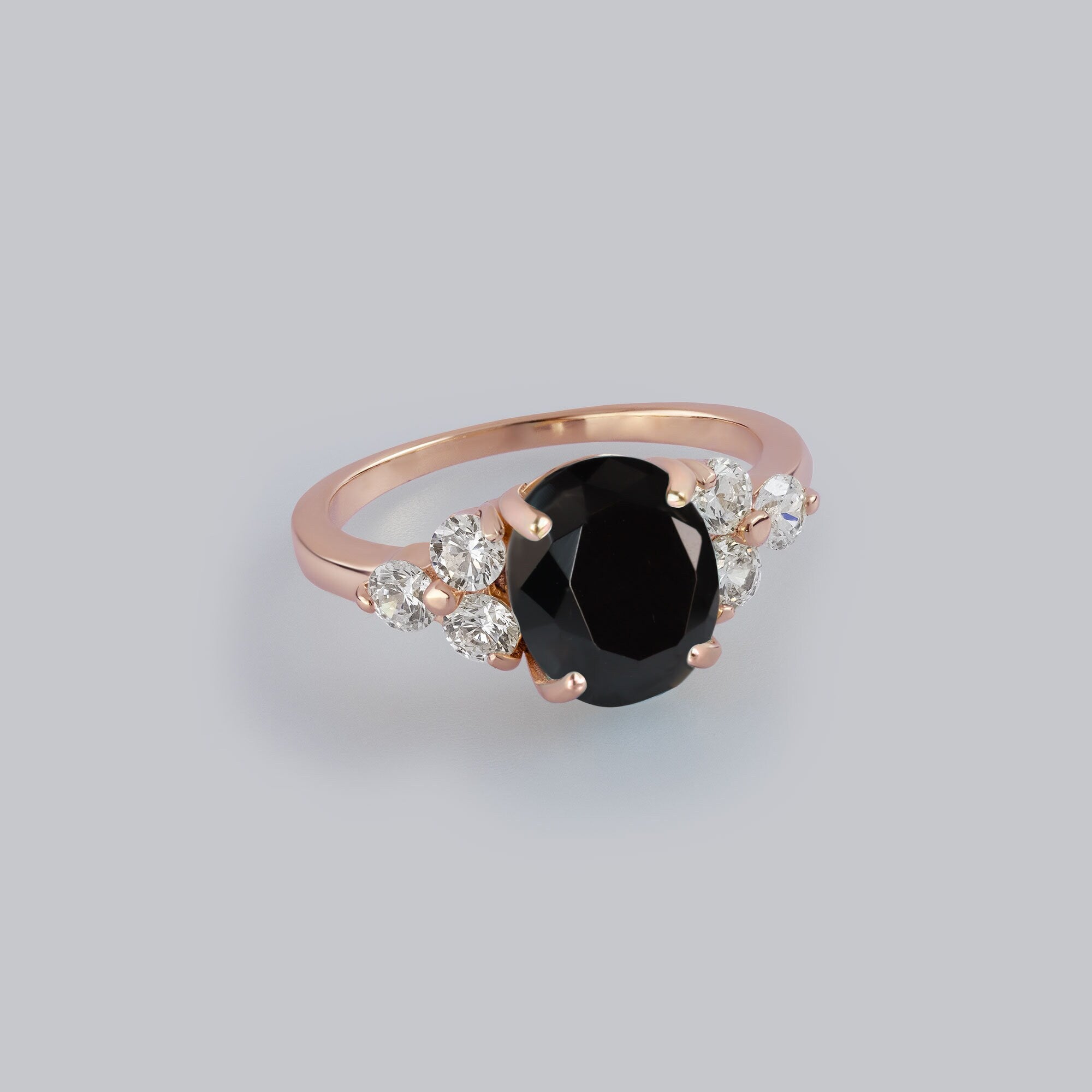 An absolute stunner, classic natural onyx engagement ring with an oval cut gemstone of your choice as it’s centre stone and with round cut clear quartz on the band to further accentuate it.