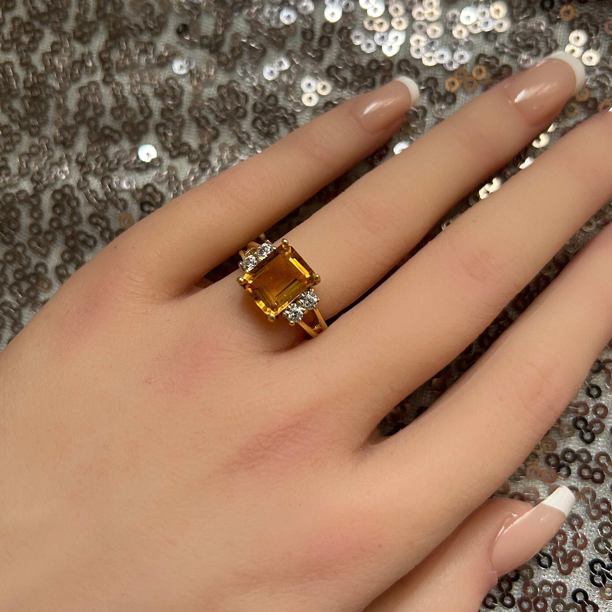 An absolute stunner, classic natural Citrine engagement ring with an emerald cut gemstone of your choice as it’s centre stone and with round cut clear quartz on the band to further accentuate it.