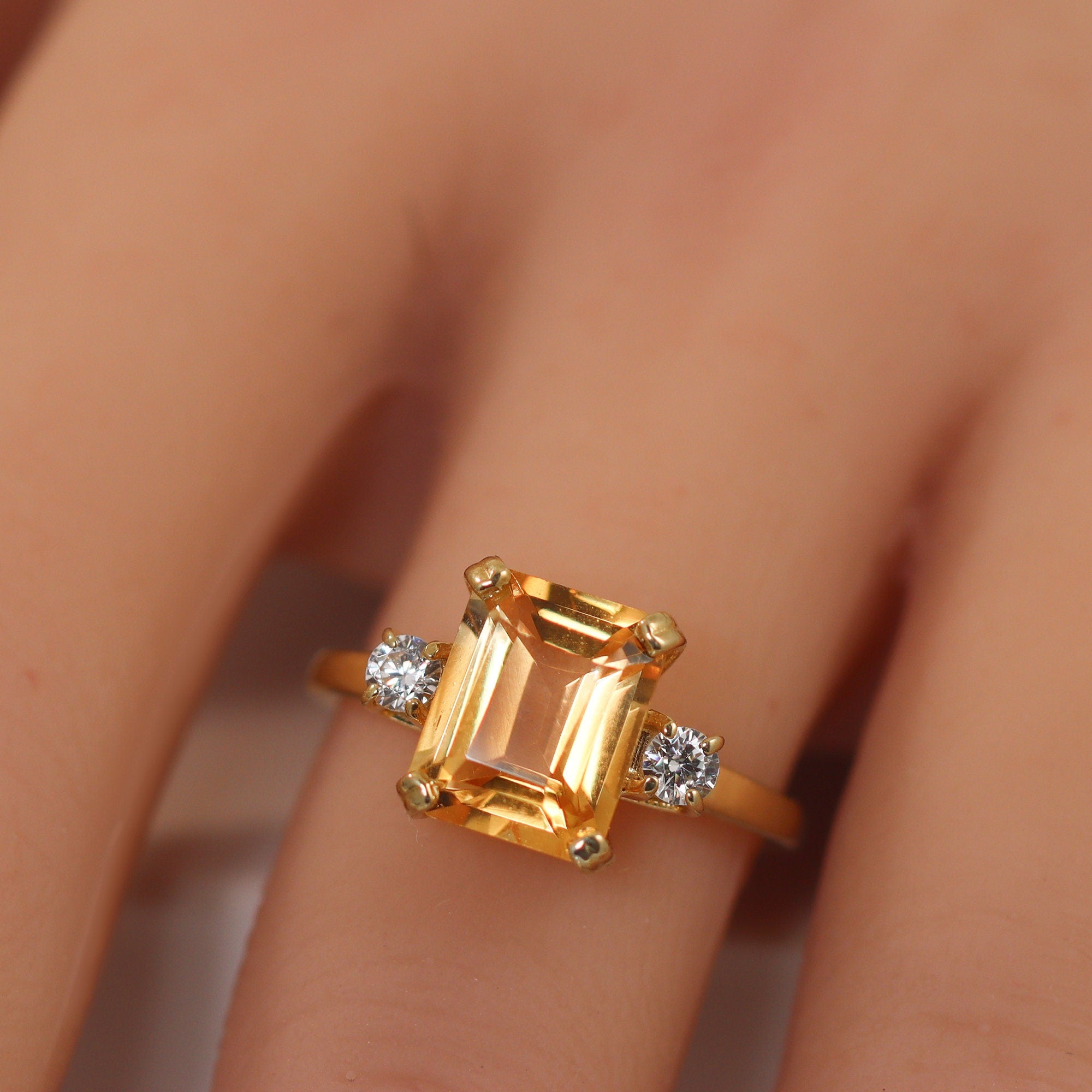 An absolute stunner, classic natural citrine engagement ring with an octagon gemstone of your choice as it’s centre stone and with round cut clear quartz on the band to further accentuate it.