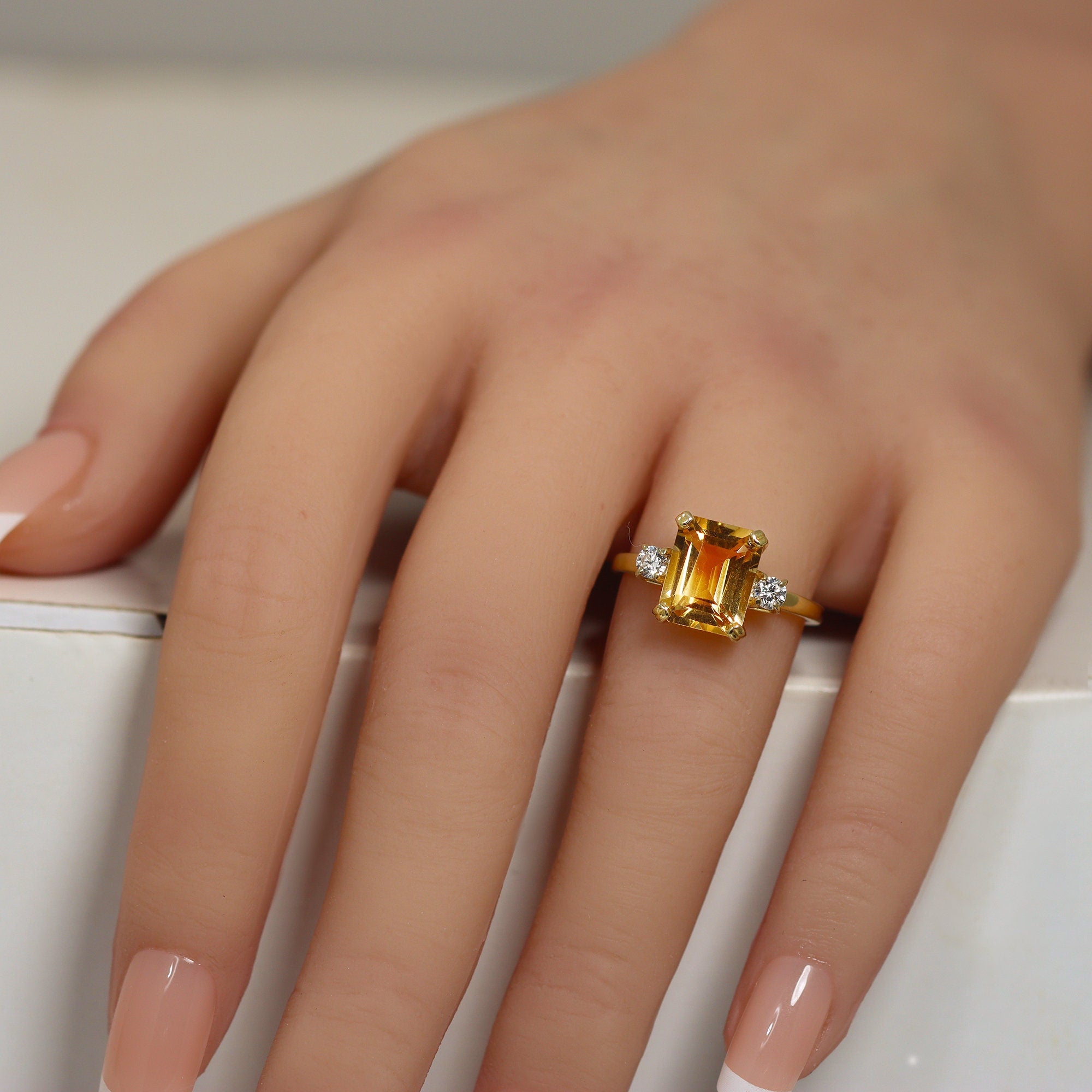 An absolute stunner, classic natural citrine engagement ring with an octagon gemstone of your choice as it’s centre stone and with round cut clear quartz on the band to further accentuate it.