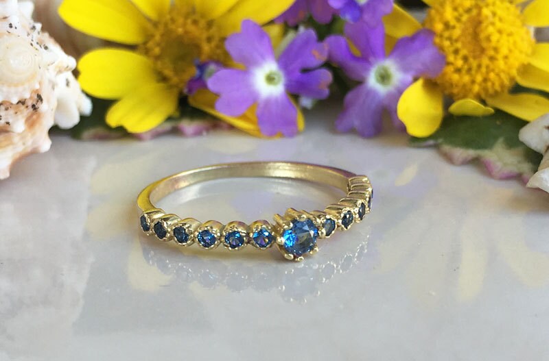 Blue Topaz Ring - December Birthstone  - Delicate Stacking Half Eternity Ring with Thirteen Round Blue Topaz Gemstones