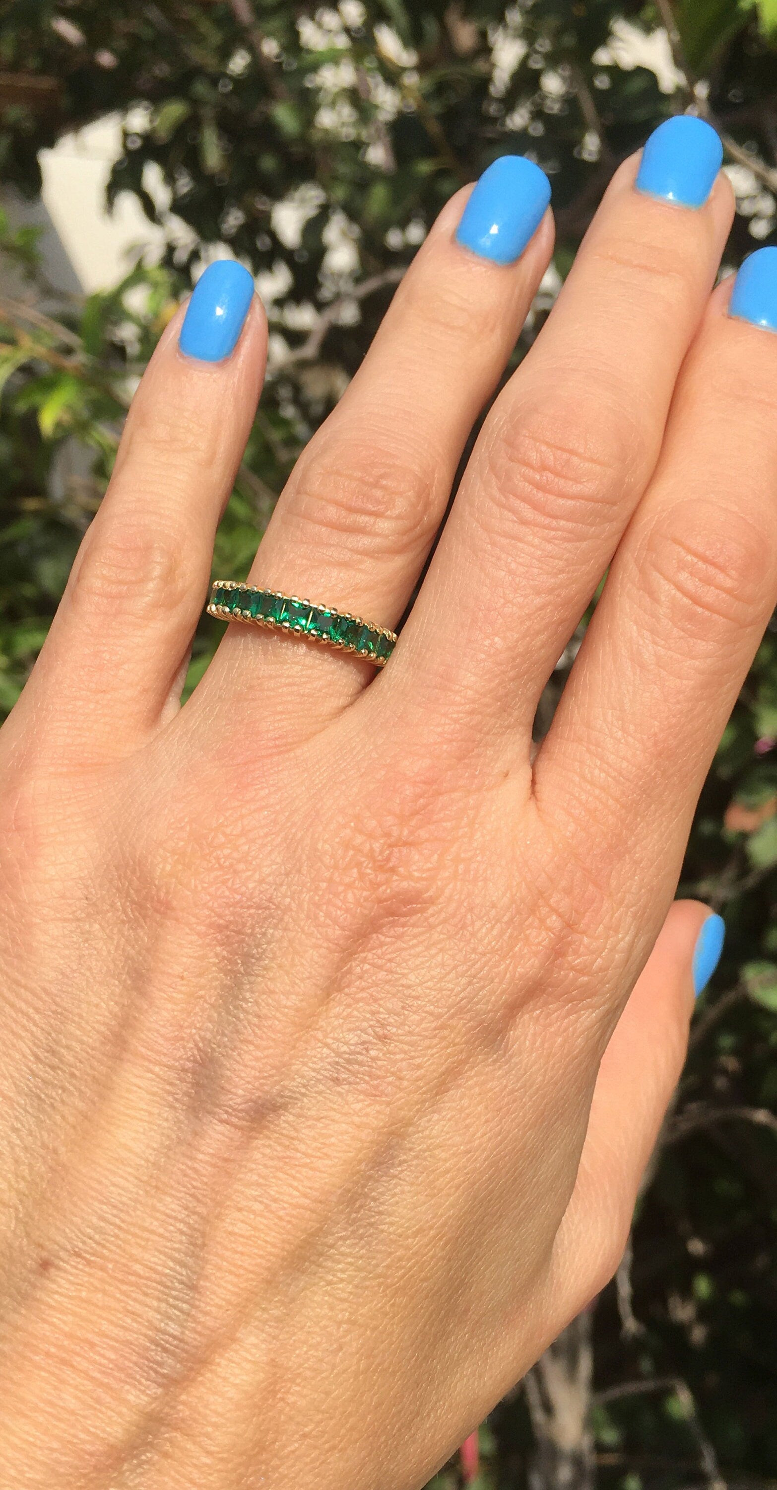 This stylish emerald half eternity ring is beautifully displayed, the fine craftsmanship shows off the row of emeralds, and their stunning sparkle. It&#39;s a beautiful gift ring for anybody who loves gemstones.