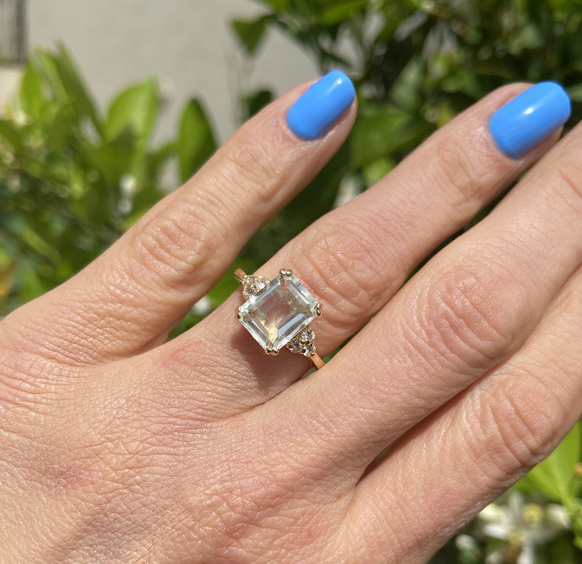 An absolute stunner, classic natural green amethyst engagement ring with an octagon cut gemstone of your choice as it’s centre stone and with round cut clear quartz on the band to further accentuate it.