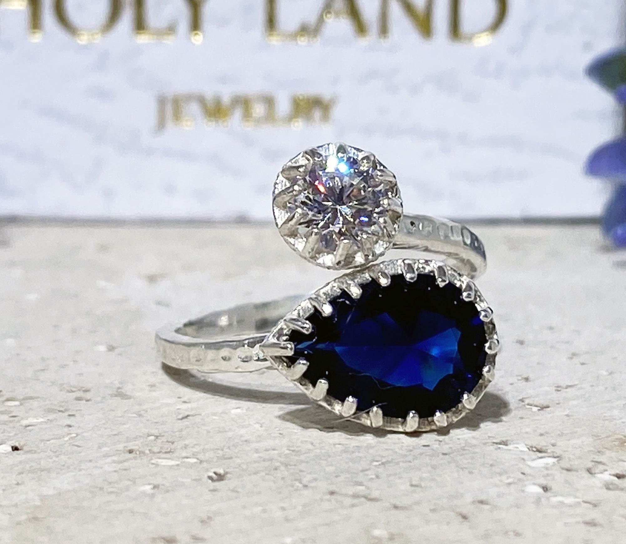 Dual Gemstone Ring - Two Birthstone Ring - Hammered Band Ring with Pear-Shaped Blue Sapphire Gemstone and Round Clear Quartz