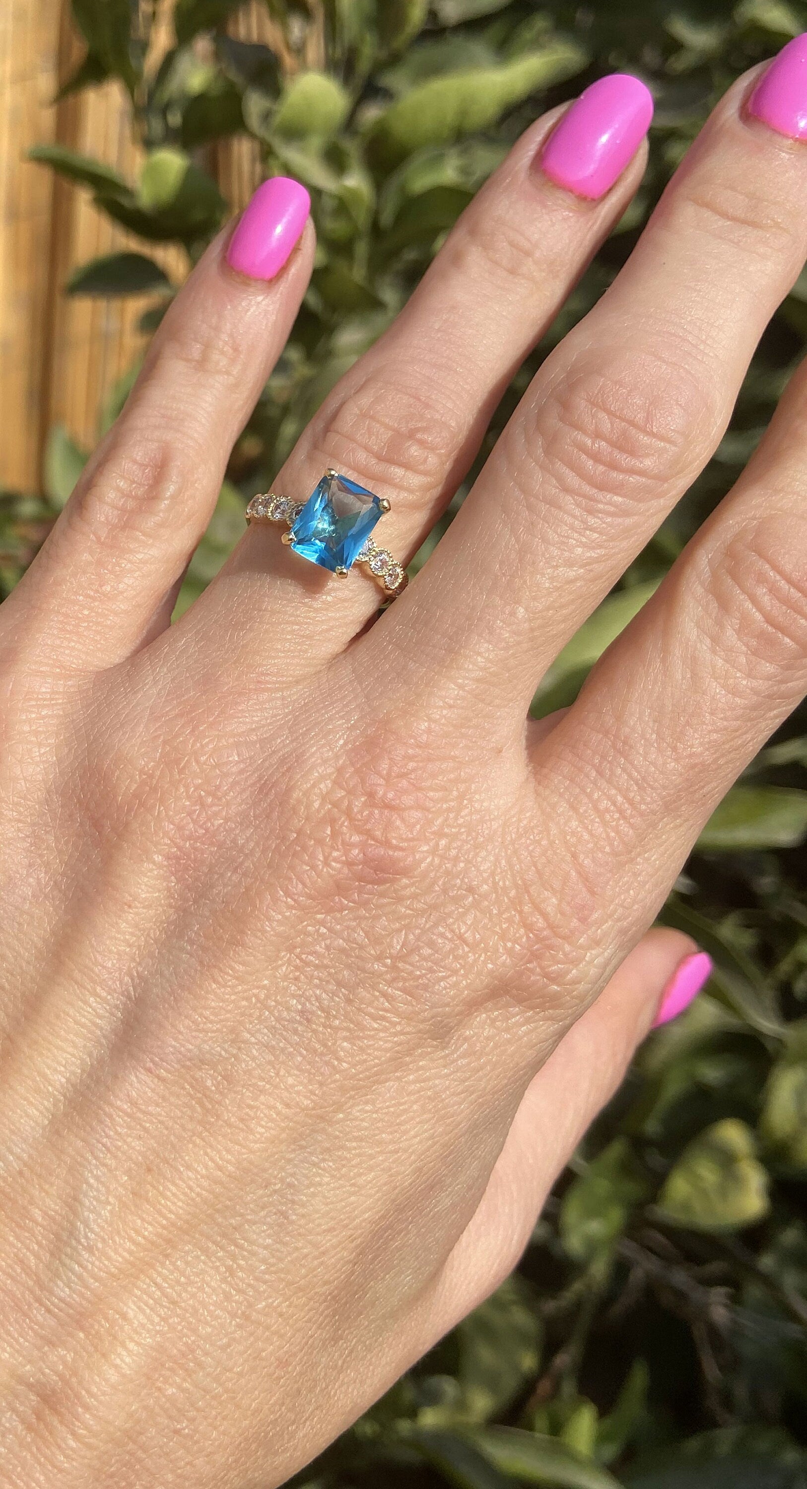 An absolute stunner, classic blue topaz engagement ring with a pear cut gemstone of your choice as it’s centre stone and with round cut clear quartz on the band to further accentuate it.