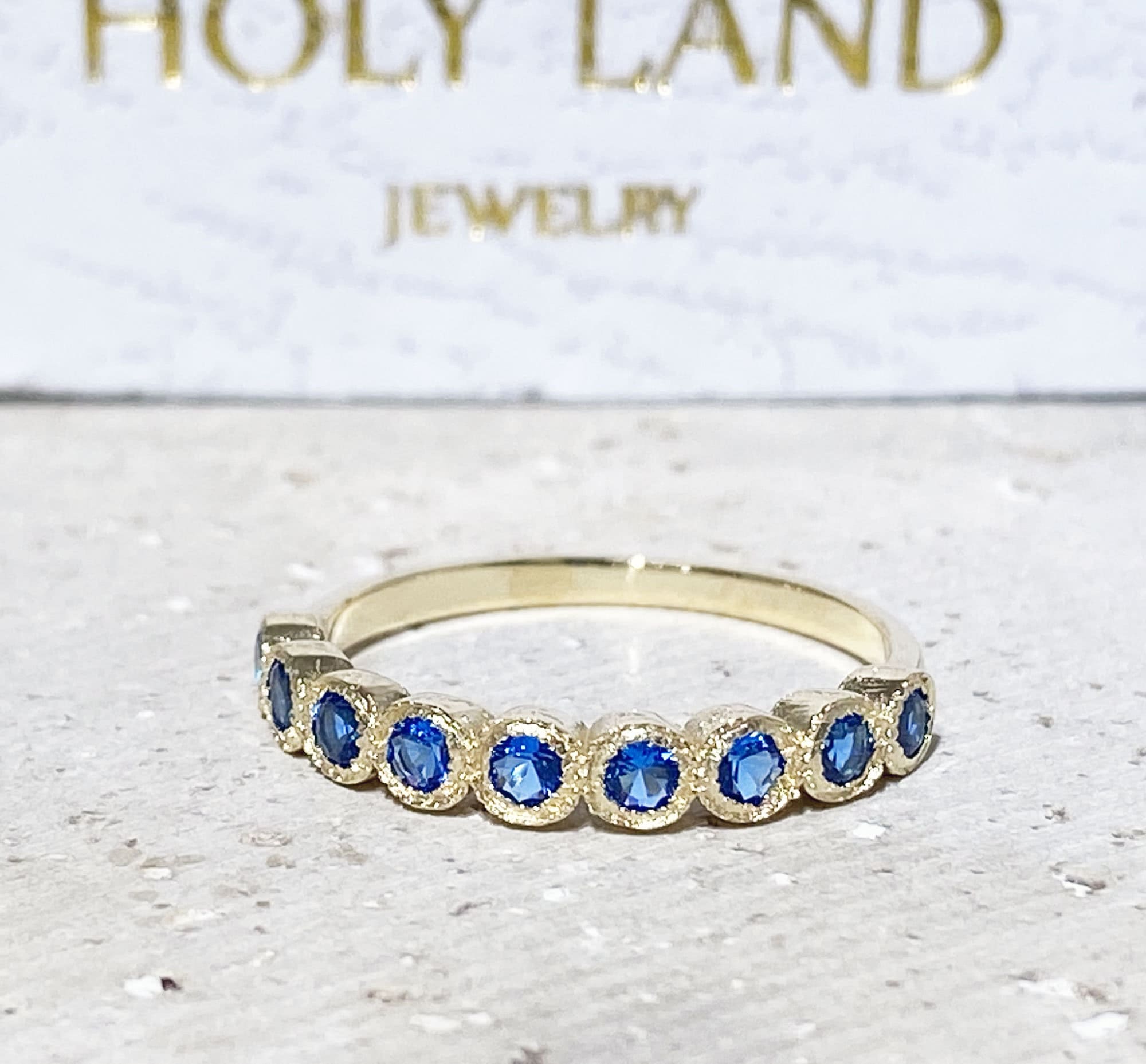 Blue Topaz Ring - December Birthstone - Delicate Stacking Half Eternity Ring with Nine Round Blue Topaz Gemstones