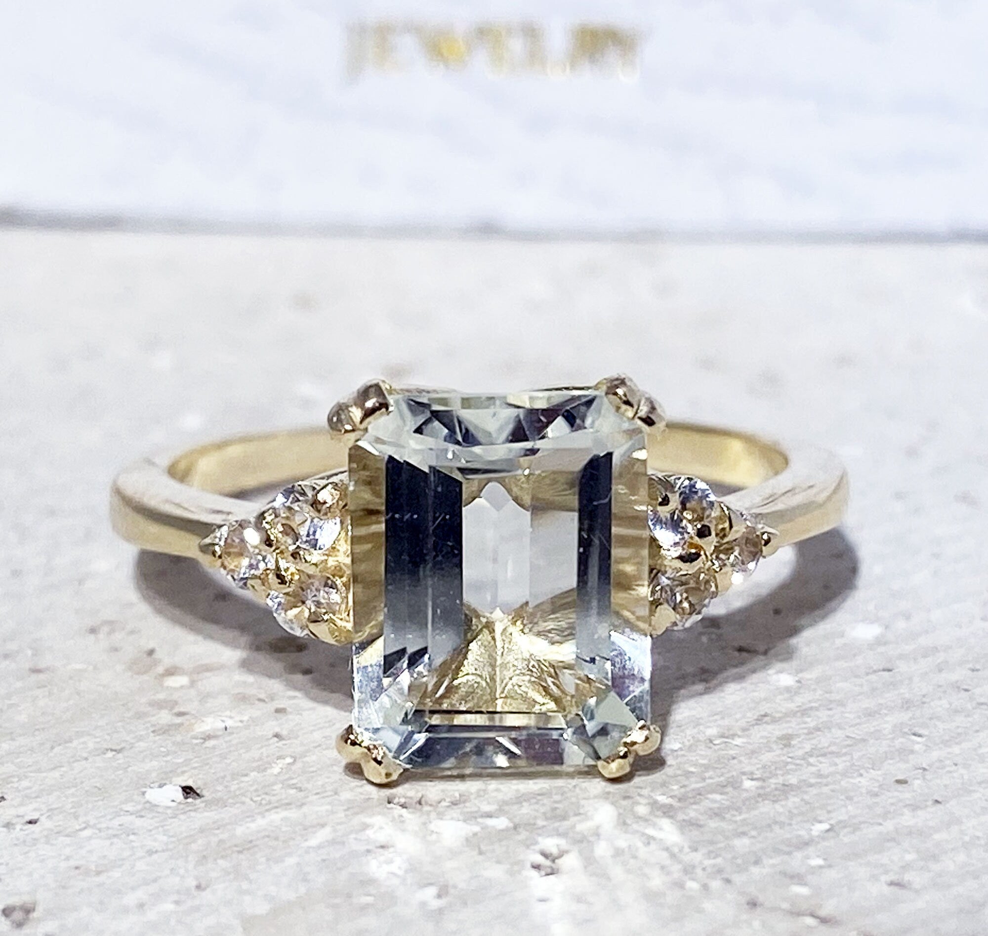 An absolute stunner, classic natural green amethyst engagement ring with an octagon cut gemstone of your choice as it’s centre stone and with round cut clear quartz on the band to further accentuate it.