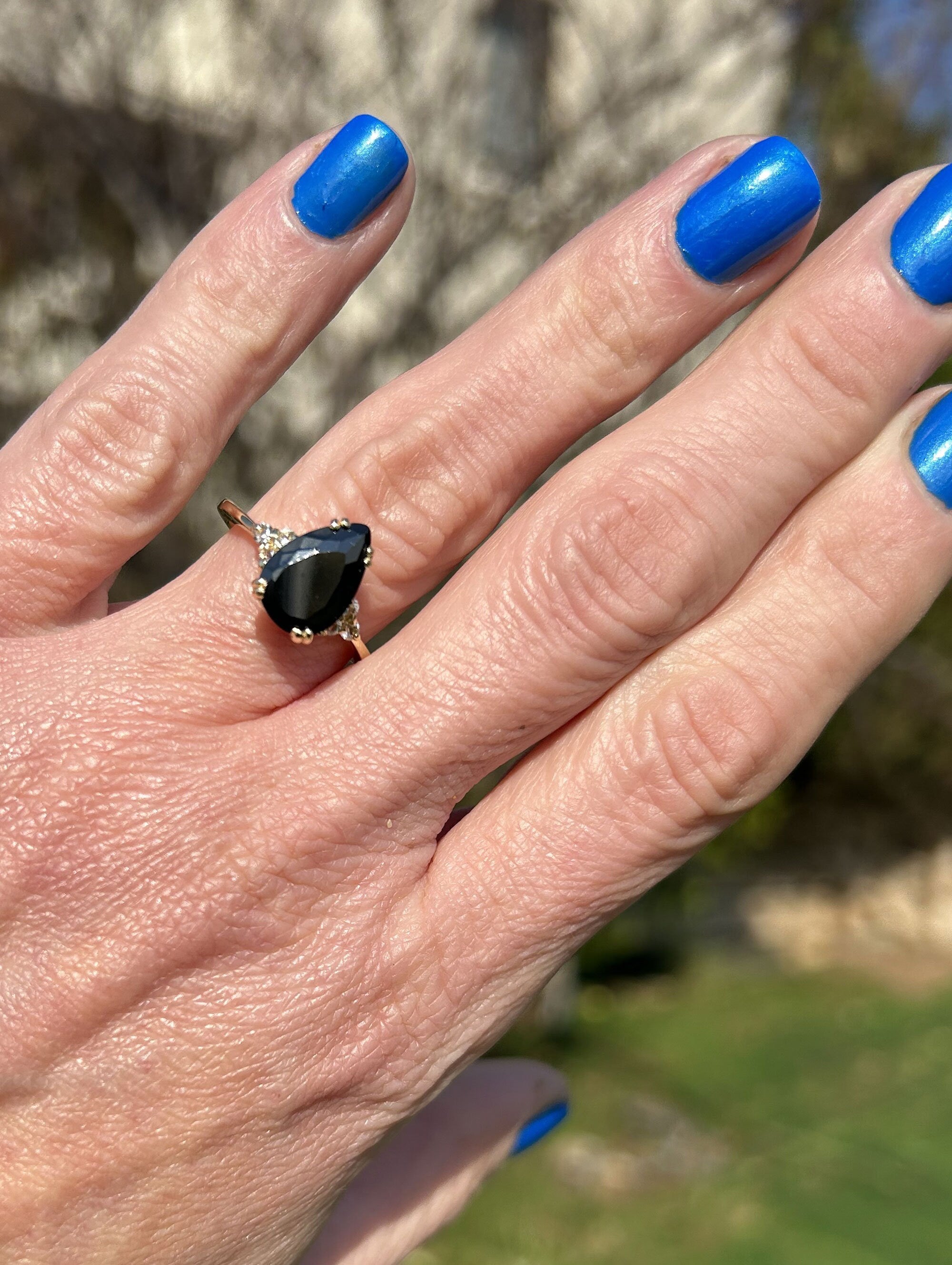 An absolute stunner, classic black onyx engagement ring with a pear cut gemstone of your choice as it’s centre stone and with round cut clear quartz on the band to further accentuate it.Black Onyx Ring - December Birthstone - Pear-Shaped Black Onyx Gemstone Statement Engagement Ring with Clear Quartz Accents