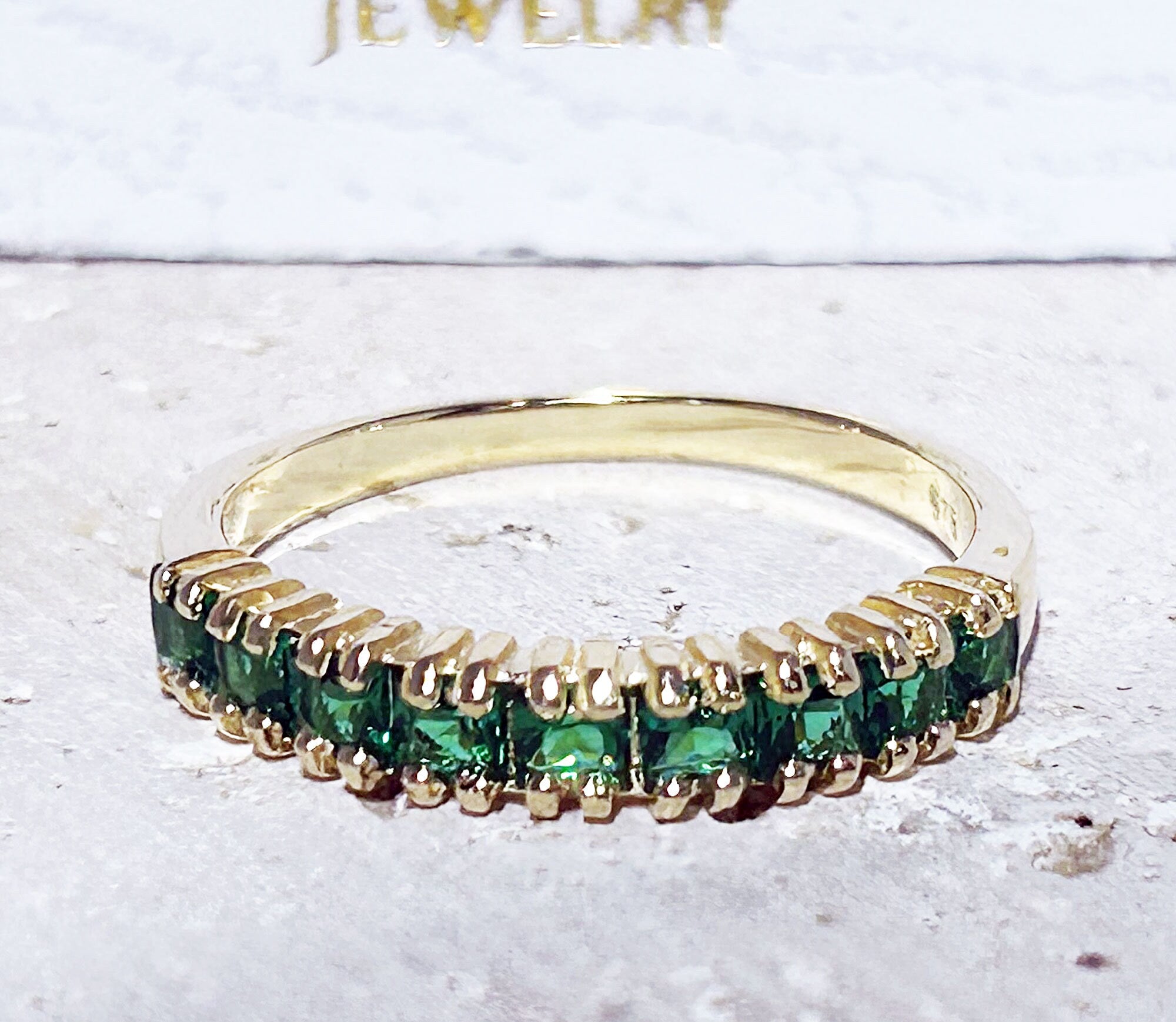 This stylish emerald half eternity ring is beautifully displayed, the fine craftsmanship shows off the row of emeralds, and their stunning sparkle. It&#39;s a beautiful gift ring for anybody who loves gemstones.