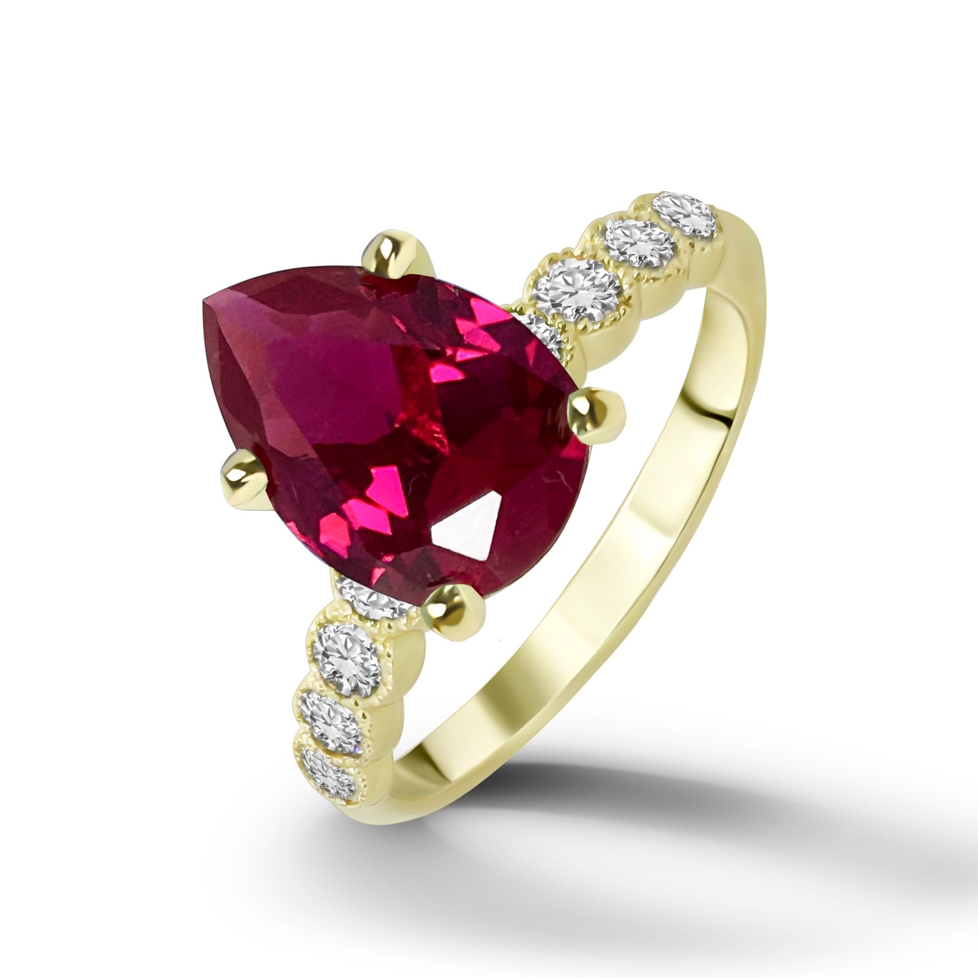 An absolute stunner, classic ruby engagement ring with a pear cut gemstone of your choice as it’s centre stone and with round cut clear quartz on the band to further accentuate it.