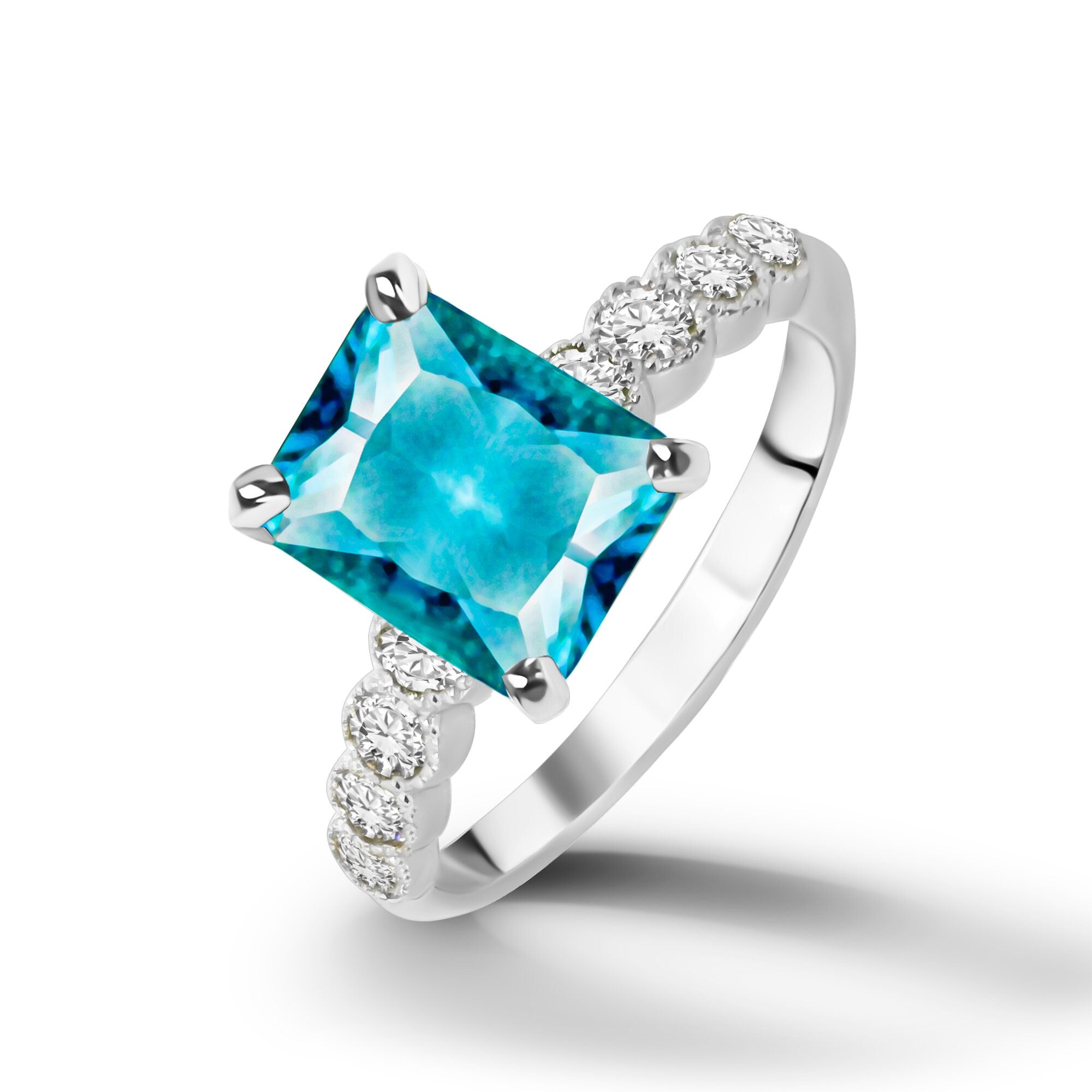 An absolute stunner, classic blue topaz engagement ring with a pear cut gemstone of your choice as it’s centre stone and with round cut clear quartz on the band to further accentuate it.